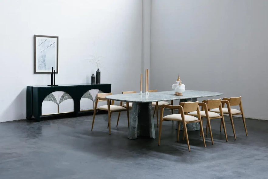 Minimalist dining room with a marble table and wooden chairs