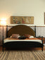 Olive green arched fabric headboard with black metal frame