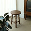 Round wooden stool with decorative turned spindle legs