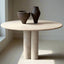 Minimalist round travertine marble table with dual cylindrical legs