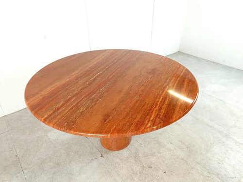 Dario round red travertine dining table