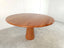 Dario round red travertine dining table