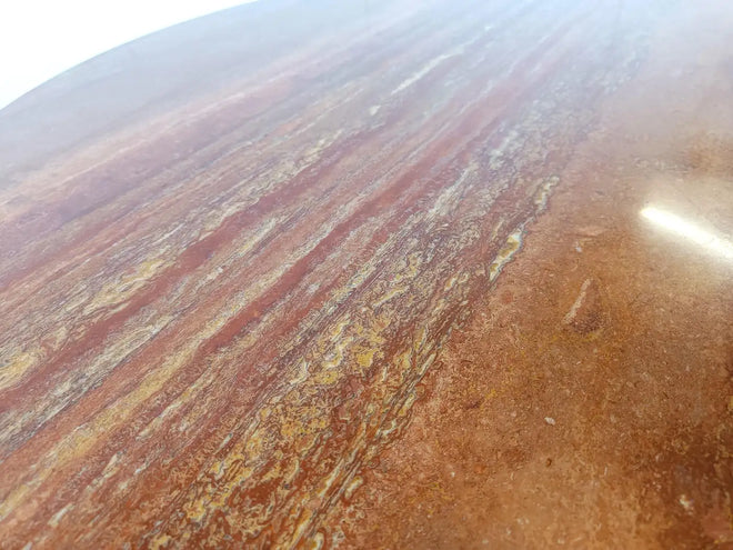 Dario round red travertine dining table