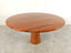 Dario round red travertine dining table