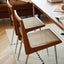  Retro industrial dining chair with an oak wood frame and woven paper rope seat.