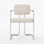 Minimalist dining chair with sleek stainless steel design.