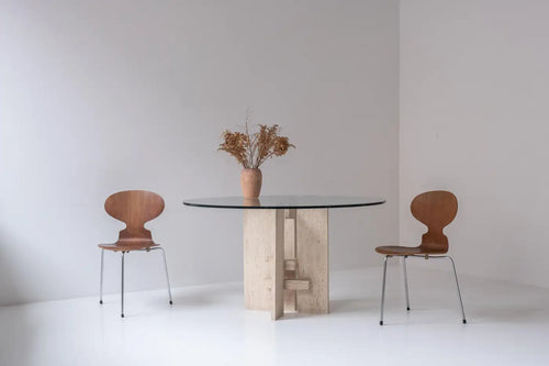 Travertine table with sculptural base designed