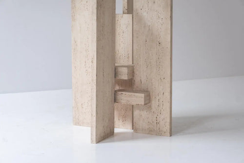 Travertine table with sculptural base designed