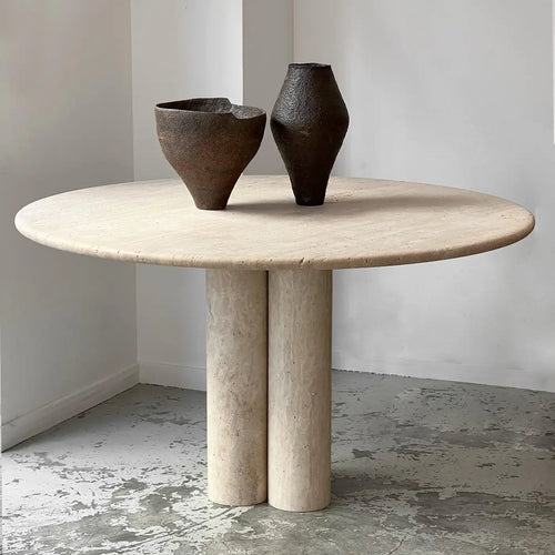 Circular travertine dining table