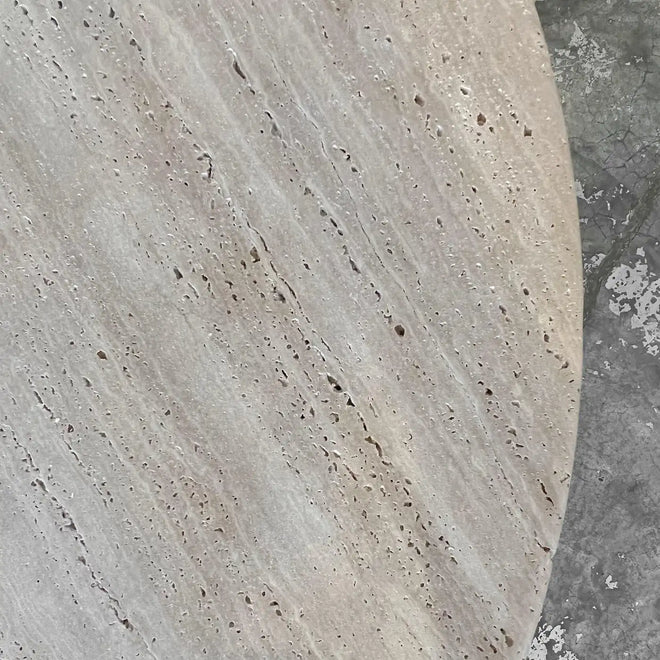 Circular travertine dining table