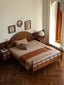 Vintage Oak Solid Wood Bed in a warm-toned bedroom.