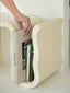 Minimalist fiberglass side table with integrated storage slot