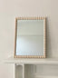 Rectangular mirror with blush pink beaded frame border