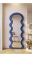 Wavy Flannel Mirror – Unique full-length mirror with vibrant blue flannel and sturdy wooden construction.