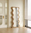 Full-length wooden mirror with wavy, undulating frame design